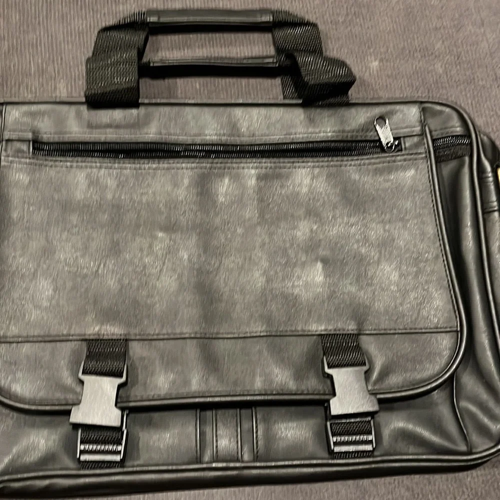 Briefcase, Black, Handles and Shoulder Straps lots of storage.